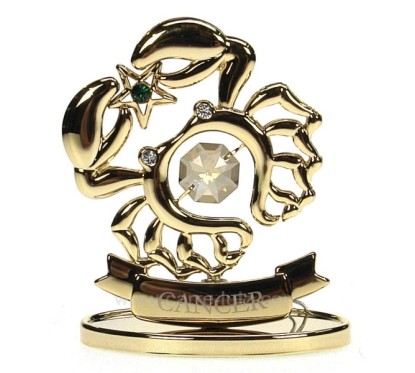 CL40002003  Signe astral en métal doré et cristaux de Swarovski 36,00 €